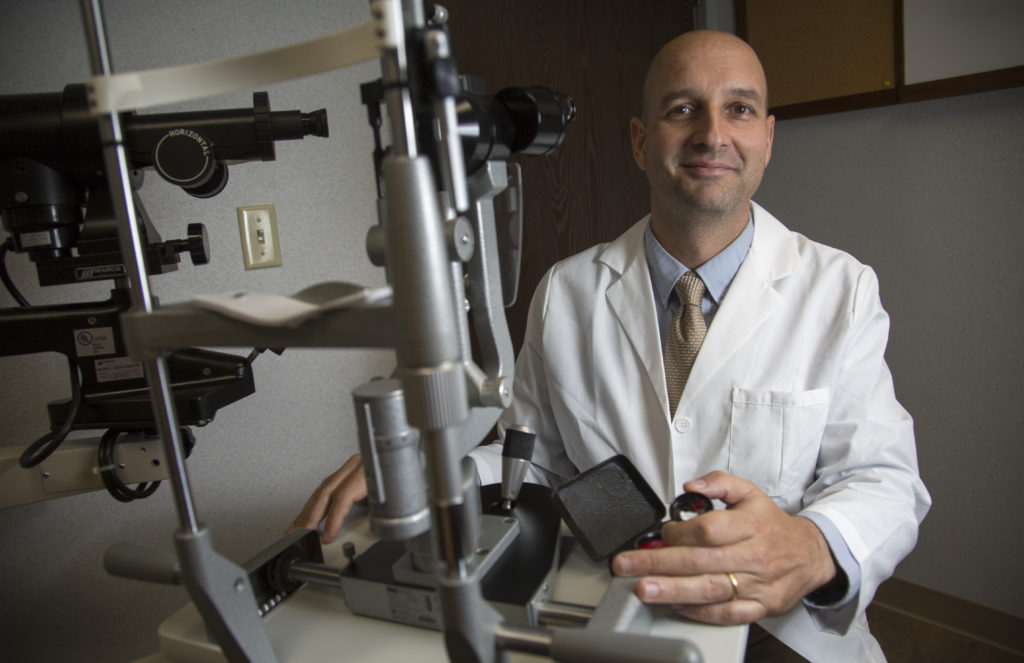 Only in Lawrence Dr. Scott Hickman, giving sight to the blind News